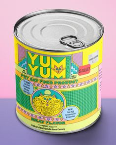 a can of yum sits on a purple surface