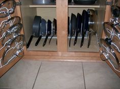 there are many pots and pans in the cupboard