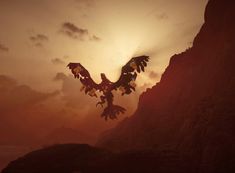 a large bird flying over a mountain at sunset