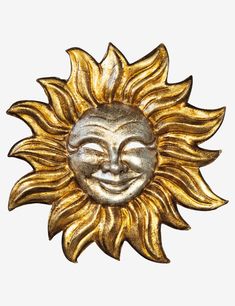 a metal sun with a smiling face on it's side, against a white background