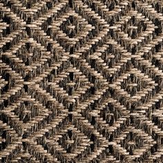 a close up view of an area rug with black and white patterns on the side