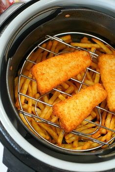 some fried fish sticks are in an air fryer