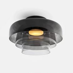 a black and clear light fixture hanging from the ceiling