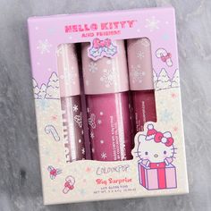 three hello kitty lip glosses in a gift box