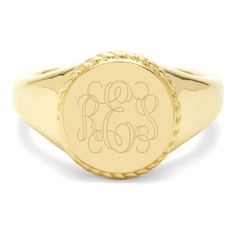 a gold signet ring with the word monogram on it's center and two initials