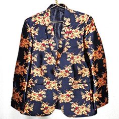 Mr. Boss Nwot Brocade Dinner Tux Jacket Men's Sz 40r Navy & Gold Roses Holidays Every Girl's Crazy For A Sharp Dressed Man, And This Stunning Jacket Fits The Bill. Unique Floral Brocade Dinner/Tux Jacket Navy With Gold And Burgundy Roses Front Two Button And Two Pockets Fully Lined In Navy Poly/Rayon Blend Made By Mr. Boss Size 40r New Without Tags Measurements Chest: 44" Shoulder Seam: 18.5" Sleeves: 25.5" Length: 30.5" Condition: New Without Tags Fitted Floral Print Winter Blazer, Fitted Floral Print Blazer For Winter, Formal Fitted Outerwear With Floral Print, Fall Blue Floral Print Blazer, Fall Floral Print Blue Blazer, Blue Floral Print Fall Blazer, Boss Suits, Burgundy Roses, Gold Roses