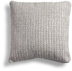 a gray and white pillow on a white background