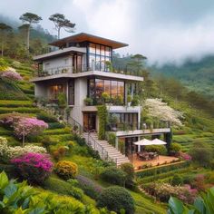 the house is surrounded by lush green hills