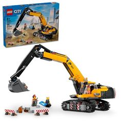 a lego construction set with an excavator in the box and people around it