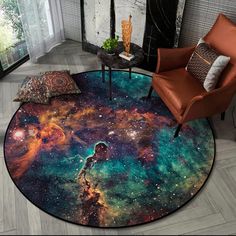 a living room area rug with an image of the stars and planets in space on it