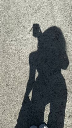 the shadow of a person standing in front of a camera