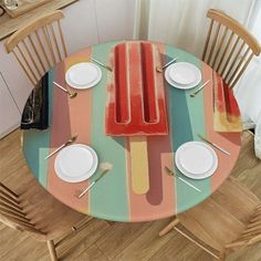 the table is set with plates and utensils