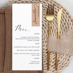 a place setting with gold forks and knifes