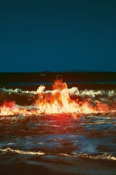 there is a fire in the ocean with waves