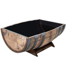 an old wooden barrel with black top on a stand for display or wine casks