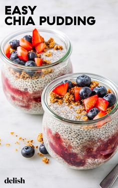 two glass jars filled with chia pudding and berries