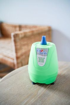 a baby bottle sitting on top of a wooden table