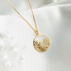 "GOLD WAVE NECKLACE, Dainty Wave Pendant, Everyday necklace, Personalized Minimalist Ocean Wave Jewelry Wonderful delicate necklace perfect for gift giving:) ♡ DETAILS  Diameter: 0.62\"- 16 mm Lenght: 17.7\"- 45 cm Material: gold plated 24 k over  sterling silver 925 ♡ PERSONALISATION You can personalize this necklace by adding initial charm or birthstone.  Here you can check if your letter is available: https://www.etsy.com/listing/589194296/add-an-initial-charm-personalized-letter?transaction_ Gold Round Pendant Necklace For Beach, Gold 14k Gold Filled Necklaces For Beach, Gold Clavicle Chain Necklace For Beach, Gold Round Pendant Jewelry For The Beach, Gold Necklace With Delicate Chain For Beach, Minimalist Gold Necklaces For The Beach, Gold Minimalist Necklace For Beach, Minimalist Gold Necklace For Beach, Dainty Yellow Gold Necklace For Beach