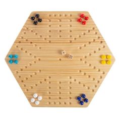 a wooden peg board with several different colored buttons on the top and bottom half of it