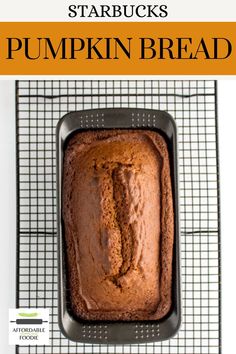 a loaf of pumpkin bread sitting on top of a cooling rack with the words starbucks's pumpkin bread