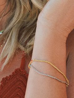 The perfect summer bracelet is here — meet the Precious Stone and Chain Bracelet. Not only is this dainty bracelet perfect for layering, but it also comes in gold and silver. The gold bracelet features an orange stone, while the silver bracelet features a blue stone. For a full look, pair this chain and gemstone bracelet with anything from our collection of colorful jewelry. Summer Bracelet, Orange Stone, Dainty Bracelet, Summer Bracelets, Silver Chain Bracelet, Full Look, Colorful Jewelry, Dainty Bracelets, Jewelry Cleaner