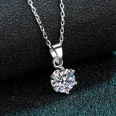 Feel classic and never out of style with this luxurious 6-prong setting solitaire necklace. Crafted from S925 white gold plated VVS D color Moissanite, this necklace adds a touch of minimalist beauty to your wardrobe. Available in a range of carat weights, from 0.5 to 5 carats - it's sure to impress. Isn't it time to treat yourself? Moissanite disperses light very well and sparkles for a lifetime. It has higher light refraction than a Diamond but is less likely to attract grease or dirt. This necklace is an accessible luxury and can surprise your beloved on a particular day. GRA Certificate & Deluxe Gift Box included. Contact us if you want to customize your design. AZ078-X Claw Necklace, Diamond Wedding Jewelry, Boys Jewelry, Special Necklace, Moissanite Necklace, Mens Jewelry Necklace, Mens Anniversary Gifts, Neck Jewellery, Sterling Silver Engagement Rings