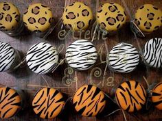 there are many decorated cupcakes with zebra print designs on the top and bottom