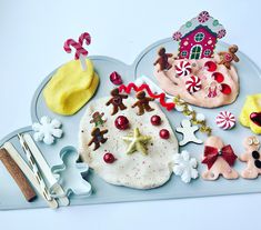 a tray filled with christmas cookies and decorations