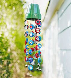 a wind chime made out of plastic bottle caps