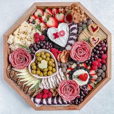 a wooden platter filled with different types of food