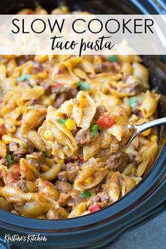 slow cooker taco pasta in a crock pot with the title above it