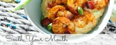 a bowl filled with shrimp and grits on top of a table