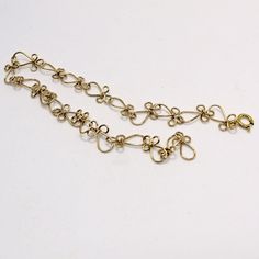 Gorgeous, lacy handcrafted links that look like little Egyptan ankhs (or angels if you turn them upside-down!) Made with 14kt gold filled wire. This unique anklet closes with a sturdy 14kt gold filled spring ring. Choose the length you need for a perfect custom fit! Elegant Metal Chain Bracelet For Festivals, Elegant Chain Bracelet For Festival, Elegant Gold Chain Bracelet For Festivals, Gold Wire Wrapped Bracelets For Festivals, Wire Wrapped Gold Bracelets For Festival, Gold Wire Wrapped Bracelet For Festival, Elegant Adjustable Chain Bracelet For Festivals, Adjustable Anklet With Lobster Clasp, Elegant Adjustable Metal Anklets