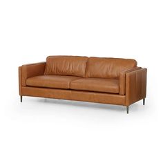 Clean, mid-century styling adopts regality via jewel tone upholstery. Rich butterscotch top-grain leather forms tailored lines while slim legs of antique brass add a sophisticated finishing touch. Plush Sofa, Lulu And Georgia, Leather Couch, Brown Sofa, Burke Decor, Mid Century Style, Top Grain Leather, Room Sofa, Leather Upholstery