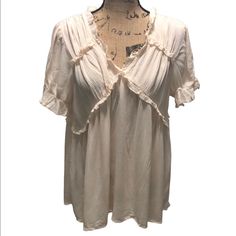 Sheer Ruffled Short Sleeve Blouse Brand New With Tags! 100% Rayon Bust Measures Approx 22.5" Laying Flat Length Measures Approx 28.5" Feminine V-neck Top With Ruffle Hem, Feminine Flowy V-neck Top, Spring V-neck Peasant Top With Ruffles, Flowy V-neck Rayon Peasant Top, Bohemian V-neck Top With Ruffle Hem, Flowy Ruffled Tops For Brunch, Bohemian Ruffle Tops For Day Out, Bohemian Ruffled Tops For Day Out, Flowy Feminine Top With Ruffle Hem