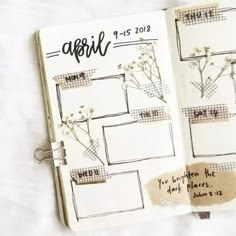 an open planner with notes and flowers on it