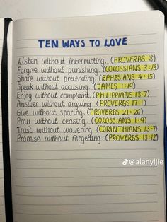 an open notebook with the words ten ways to love written in blue and yellow on it