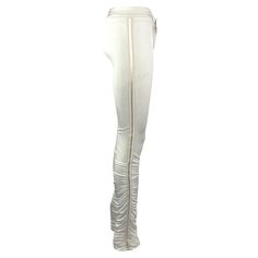 Presenting a pair of white Gucci pants, designed by Tom Ford. From the Fall/Winter 2004 collection, these form-fitting satin pants feature ruching at the calves and are made complete with a monochrome striped ribbon on either side. Never worn before, these fabulous Gucci by Tom Ford pants are made complete with the original brand tags still attached. Part of Ford's final collection at Gucci, these pants are reminiscent of the ruched pants from Gucci's Fall/Winter 1999 collection. Approximate mea Elegant Gucci Formal Pants, Gucci Designer Fitted Pants, Gucci Fitted Formal Pants, Designer Fitted Gucci Pants, Tom Ford Pants, Gucci By Tom Ford, Gucci Pants, 00s Style, Ruched Pants