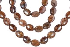 two strands of brown and white stone beads