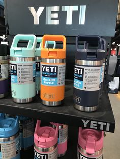 the yeti water bottles are on display for people to see them in their store