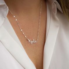 Sparkle like the coast of Italy with our beautiful Amalfi Name Necklace! Its delicate and dainty custom design will turn heads and inspire confidence, making you feel like you can conquer anything. Wear this personalized piece alone for everyday elegance or layer it with your favorite necklaces for an elevated look. Embrace the charm and sophistication of this stunning accessory. Silver Necklace With Adjustable Chain For Bridesmaid, Custom Name Jewelry For Bridesmaid Gift, Silver Clavicle Chain Necklace For Bridesmaids, Custom Name Silver Necklace For Bridesmaid Gift, Silver Name Necklace For Bridesmaid, Personalized Silver Necklaces For Bridesmaids, Name Necklaces For Bridesmaid Gift, Minimalist Name Necklace For Bridesmaids, Dainty Name Necklace For Bridesmaid Gift