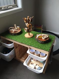 a green table with bowls and cups on it