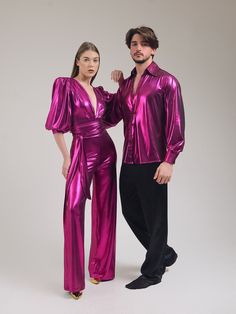 "Our matching Studio 54 party outfit is a special twin set, a piece of design that will make you feel different and special at all parties, festivals, disco-themed entertainments. Bright fuchsia wide sleeve, wide leg, deep V jumpsuit and our bright shirt with wide collar for partner is ready to fascinate everyone! The fuchsia jumpsuit with metallic reflections is quite ambitious with a deep V-neckline. It also has a noble appearance. This is exactly a piece of design. A great piece for private p 70s Outfits Men Party, Couples Disco Outfits, Fitted V-neck Evening Sets, Elegant Long Sleeve Sets For Costume Party, Elegant Full-length Party Sets, Elegant Full Length Party Sets, Pink Fitted Costume Party Set, Fitted Pink Set For Costume Party, Pink Fitted Set For Costume Party