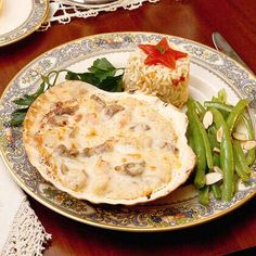 a dinner plate with green beans, rice and meat