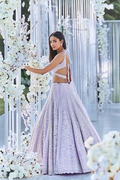 This lehenga set features pearl, sequin & crystal embroidery on a lavender net base. The skirt is paired with fully embellished blouse with dual strings at the back and a matching scalloped net dupatta.From Seema Gujral's Tuscan Summer collection. DELIVERY TIMEPlease allow 8-12 weeks for your outfit to arrive. FABRIC DETAILSNet Professional cleaning only. Elegant Lavender Lehenga With Sheer Dupatta, Festive Lavender Lehenga With Sheer Dupatta, Lavender Lehenga With Dupatta For Reception, Reception Lavender Lehenga With Dupatta, Elegant Lavender Lehenga For Party, Designer Lavender Lehenga With Sheer Dupatta, Lavender Lehenga With Zari Work For Reception, Elegant Designer Lavender Lehenga, Lavender Choli With Dupatta For Reception