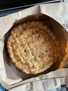 a pie sitting on top of a piece of wax paper