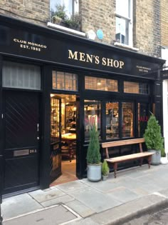 a man's shop on the corner of a street in front of a brick building