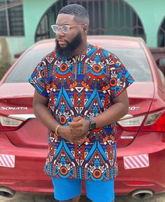 A more casual wear made with African wax print Mens African Outfits Ankara, Men Ankara Tops African Style, Ankara Male Shirts, Ghana Mens African Wear, Latest Ankara Styles For Men 2023, Mens African Print Shirts, Men African Shirts Design, Male African Shirt Designs, Ankara Dress For Men