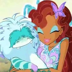 the little mermaid is hugging her pet cat