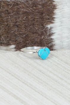 This turquoise and sterling silver inlay heart ring was made by Zuni silversmith Linda Chavez.Size: 6.25Length: 1/4"Width: 3/8"Free shipping on all orders! We ship with USPS and always include tracking. All orders ship within a day of payment.Returns are accepted up to 30 days after you receive your order. Just send us a message. Our shop offers cash back or store credit. The item must be returned in new condition. Promise Rings Turquoise, Heart-shaped Turquoise Blue Ring For Gift, Heart-shaped Turquoise Ring As Gift, Heart-shaped Blue Turquoise Ring For Gift, Heart-shaped Blue Turquoise Ring Gift, Heart-shaped Turquoise Sterling Silver Ring, Turquoise Heart Ring In Sterling Silver As Gift, Heart Shaped Silver Turquoise Ring In Sterling Silver, Turquoise Gemstone Heart Ring Gift